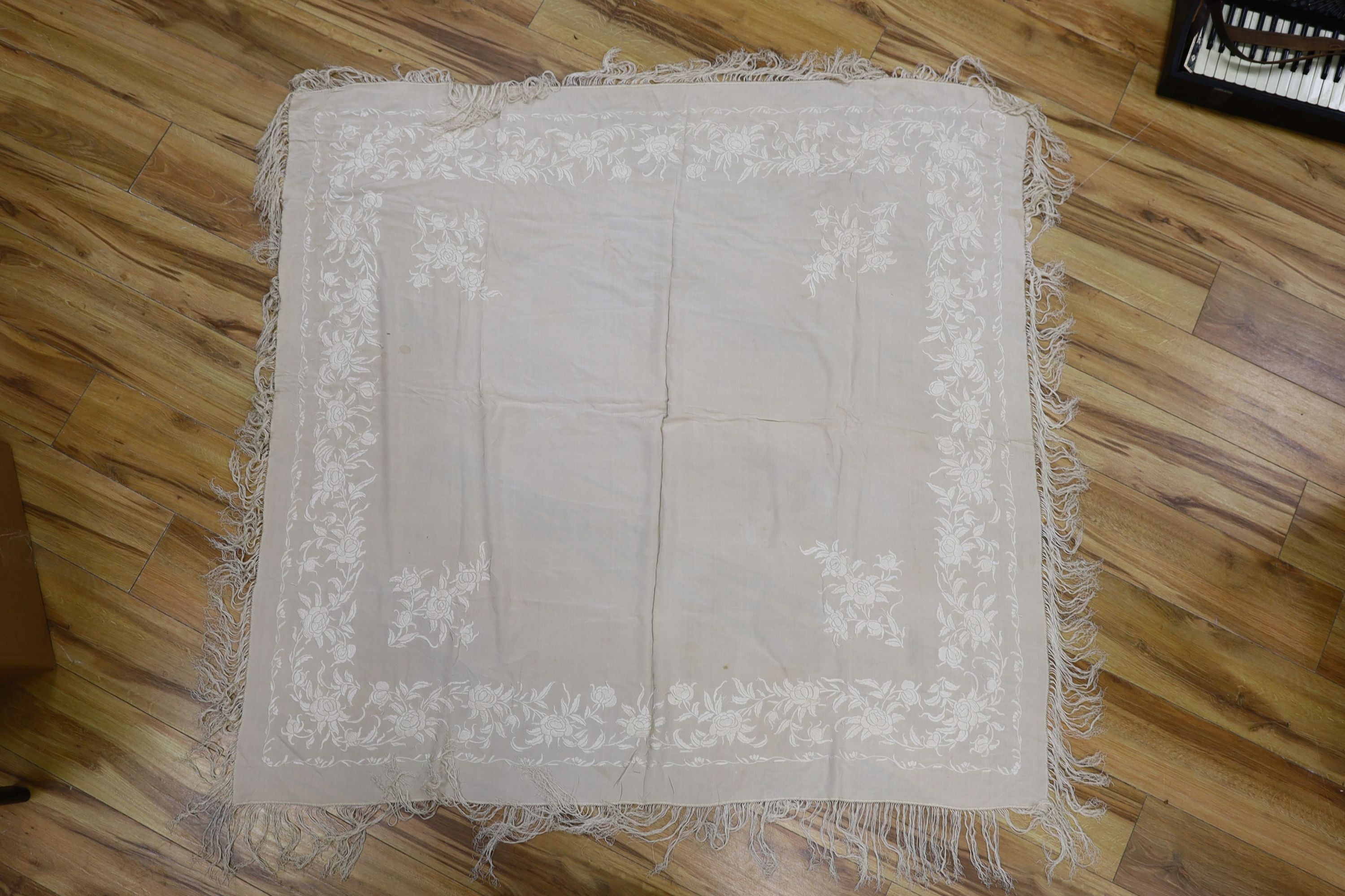 A 19th century cream embroidery on cream silk shawl together with a smaller later shawl